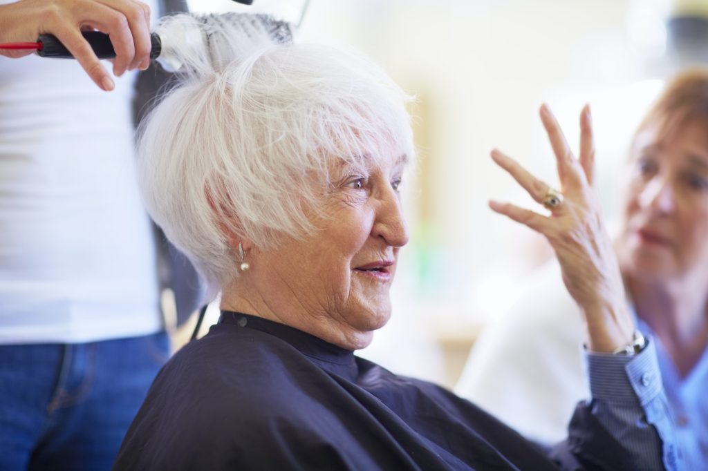 Portrait of senior woman in a hair salon